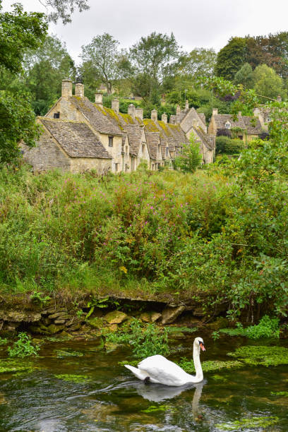 Stone cottages in Arlington Row in the Cotswold District of Gloucestershire, England stock photo