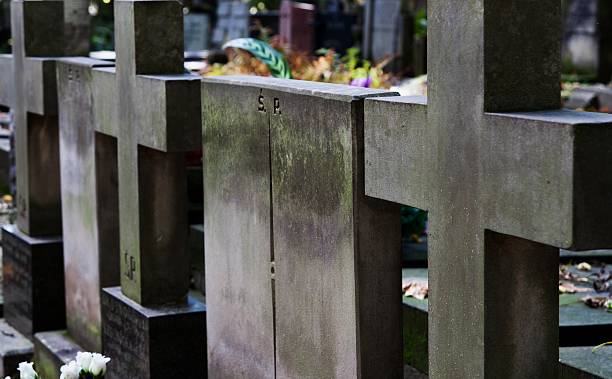 Stone crosses on cemetery stock photo