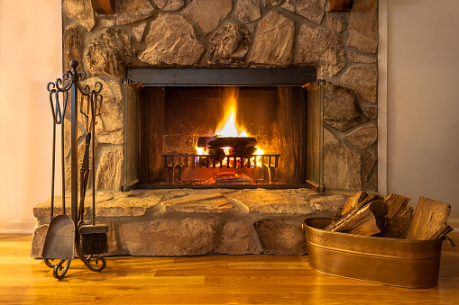 Stone Fireplace With Logs Burning In A Residential Home Stock Photo -  Download Image Now - iStock