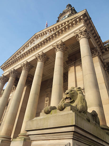 Stone lion statue and portico at neoclassical Bolton town hall stock photo