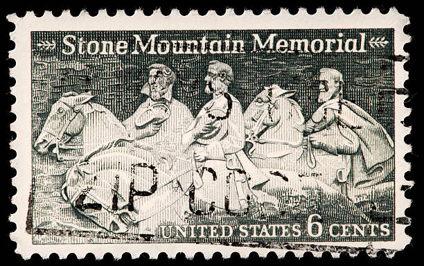 Stone Mountain Memorial Depicted on Vintage US Postage Stamp Stone Mountain Memorial with Bas Relief Carving of Stonewall Jackson, Robert E. Lee, and Jefferson Davis Depicted on Vintage US Postage Stamp. stonewall jackson stock pictures, royalty-free photos & images