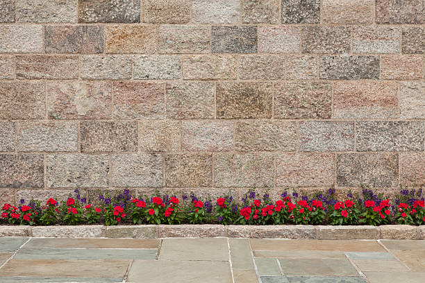 Stone Wall With Flowers stock photo