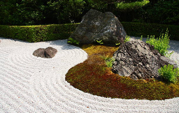 Stones and raked gravel in a zen garden stock photo