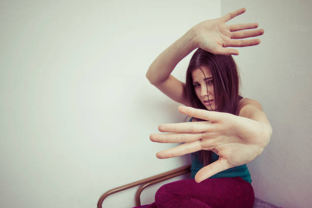 stop domestic violence concept young woman defends herself while being physically abused stock photo