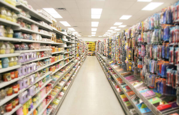 Store Shelves Miles and Miles of shelves of no-name stationary products, candles, flowers..... island stock pictures, royalty-free photos & images