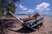 istock Storm damage. Fishing boats are damaged. Fishing boats are not available on the beach. 1148821019