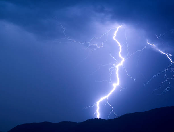 storm in the night time stock photo