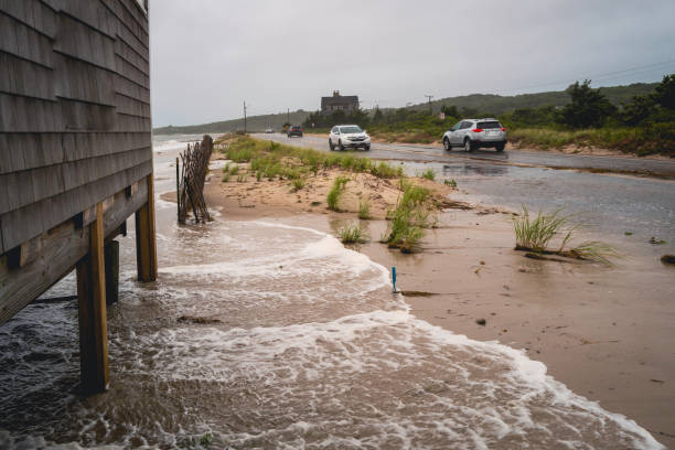 Storm Surge Floods Beach House and Road stock photo