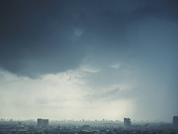 Stormy dark clouds over the city. stock photo