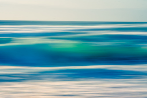 Stormy ocean, abstract seascape, motion blur in bright blue colors, copy space