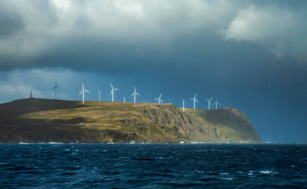 Stormy sea in the north of Norway eith wind turbines. Copyspace stock photo