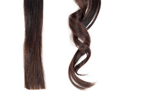 Strand Of Straight Hair And Curl On White Isolate Stock Photo