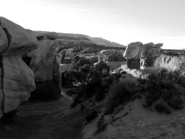 Strange Monochrome landscape, Devils garden, Escalante, Utah Devil"u2019s garden, an area filled with sandstone hoodoos, in Escalante, Utah, USA, in Black and White in the last sun of the afternoon. This area is located on the Hole-in-the-Rock Road in the Escalante-Grand Staircase National Monument. garfield county utah stock pictures, royalty-free photos & images