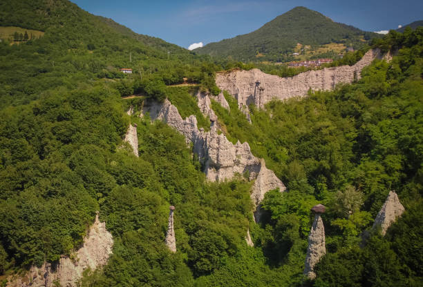 Strange unique rock formations in Pyrimidi zone near Lake Iseo, Lombardy, Italy stock photo