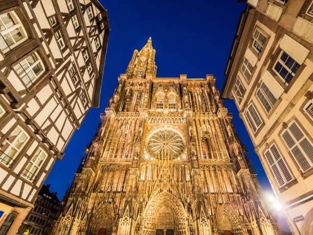 Strasbourg Cathedral or the Cathedral of Our Lady of Strasbourg illuminated at night. Alsace, France stock photo