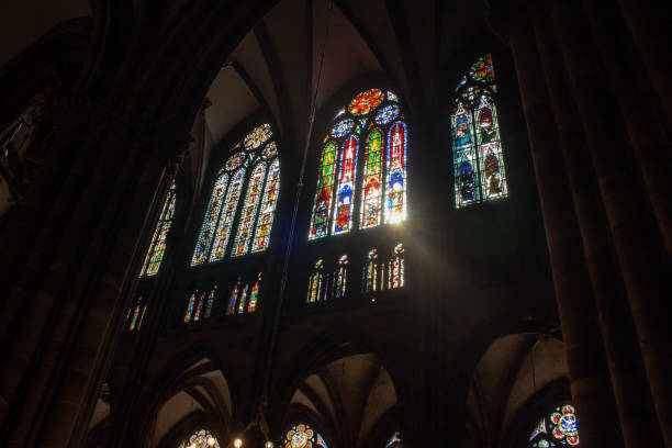 Strasbourg, France Cityscape Strasbourg, France - August 31, 2021: Interior view of a stained glass window in the historic Strasbourg Cathedral. notre dame de strasbourg stock pictures, royalty-free photos & images