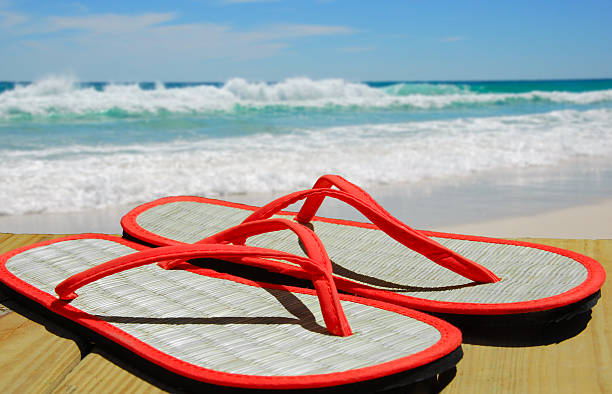 Straw Sandals on Beach stock photo