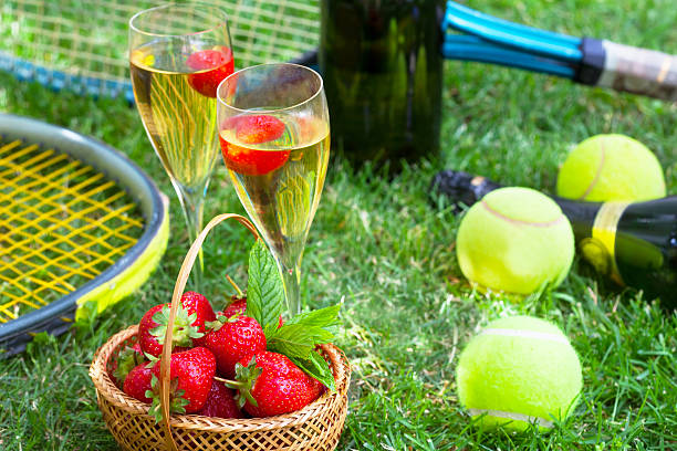 strawberries and champagne during wimbledon - wimbledon tennis stok fotoğraflar ve resimler
