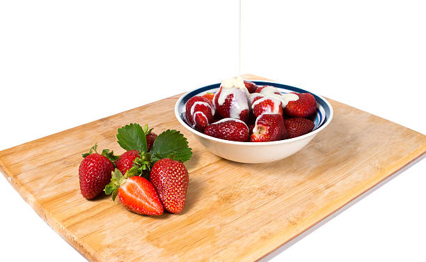 Strawberries with condensed milk stock photo