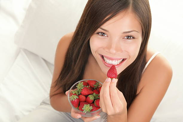 Strawberries woman stock photo