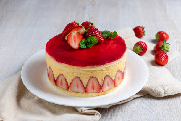 Strawberry cake, Fraisier cake on white  wooden background stock photo