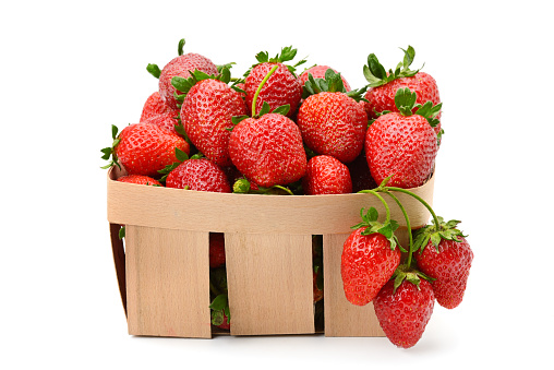 Strawberry in basket isolated on white background