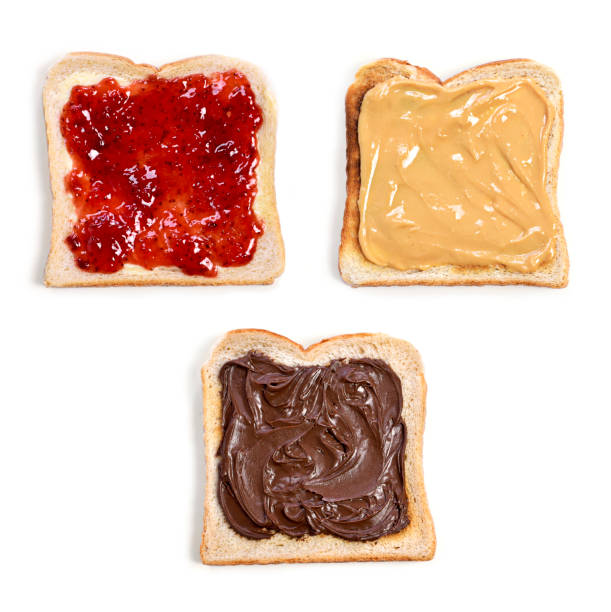Strawberry jam, peanut butter and chocolate cream toast Fresh toast bread or toasted wheat bread slices. Strawberry jam, peanut butter and chocolate cream toast bread, isolated on white background. toasted bread stock pictures, royalty-free photos & images