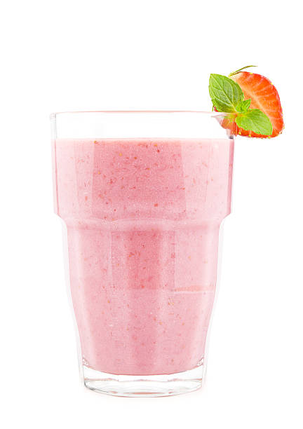 Strawberry milkshake Glass of strawberry milkshake on white. strawberry smoothie stock pictures, royalty-free photos & images