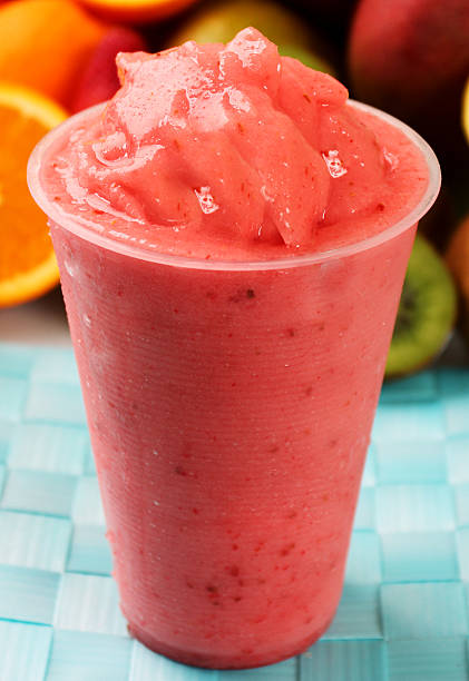 Strawberry Slush Strawberry Slush with fruit orange smoothie stock pictures, royalty-free photos & images