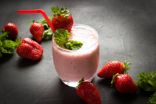 Strawberry smoothie, fresh berries,  healthy eating, dieting food, black background. Strawberry smoothie, fresh berries,  healthy eating, dieting food, black background. strawberry smoothie stock pictures, royalty-free photos & images