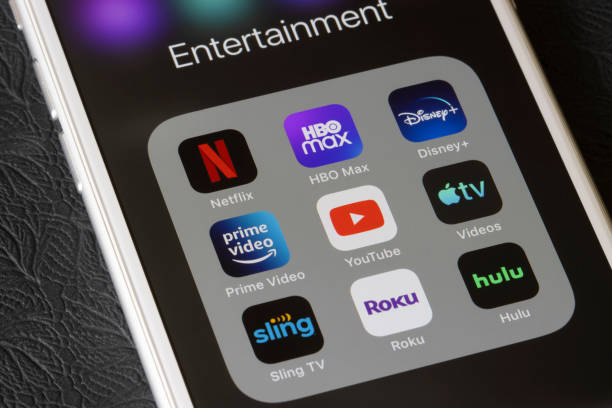 Streaming Mobile Apps Portland, OR, USA - Feb 2, 2021: Assorted streaming apps are seen on an iPhone, including Netflix, HBO Max, Disney Plus, Amazon Prime Video, YouTube, Apple TV, Sling TV, Roku, and Hulu. brand name stock pictures, royalty-free photos & images