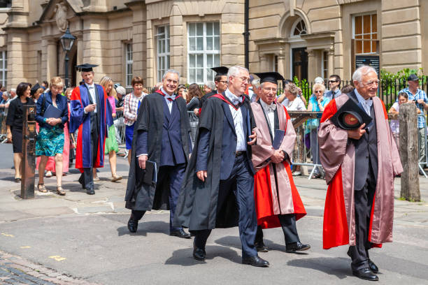 Street at graduation day. Oxford, England Oxford, England - June 19, 2013: Official proctors and Academics process along Catte street to All Souls College of Oxford University at graduation day oxford high school stock pictures, royalty-free photos & images