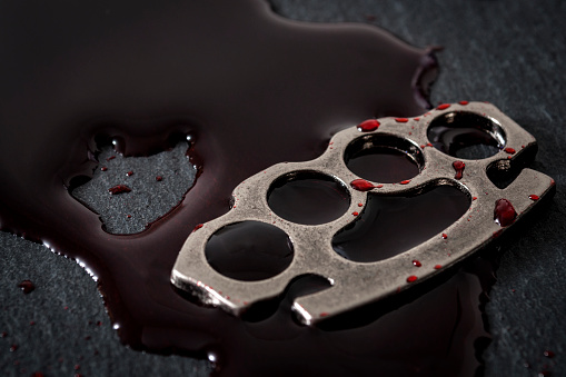Street Crime And Gang Violence Concept With Bloody Brass Knuckles Stock  Photo - Download Image Now - iStock