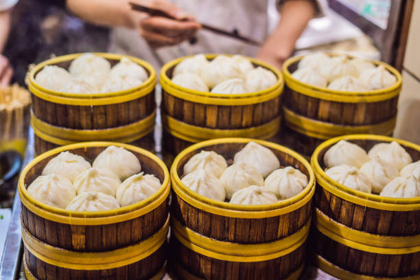 Street food booth selling Chinese specialty Steamed Dumplings in Beijing, China Street food booth selling Chinese specialty Steamed Dumplings in Beijing, China. king kong monster stock pictures, royalty-free photos & images