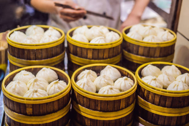 Street food booth selling Chinese specialty Steamed Dumplings in Beijing, China Street food booth selling Chinese specialty Steamed Dumplings in Beijing, China. king kong monster stock pictures, royalty-free photos & images
