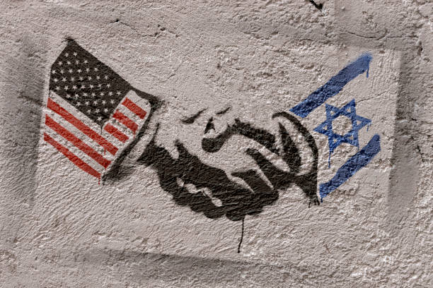 Stencil graffiti representing the agreement of two countries (USA - ISRAEL). Photographer's own design.
