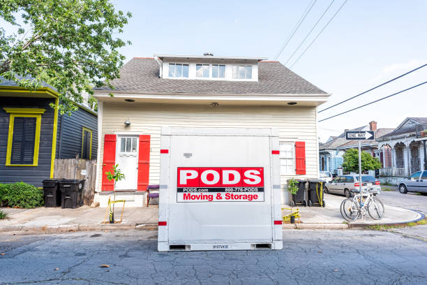 Street historic Marigny neighborhood district in Louisiana town, city sidewalk, Pods storage container for moving on road New Orleans, USA - April 23, 2018: Street historic Marigny neighborhood district in Louisiana town, city sidewalk, Pods storage container for moving on road plant pod stock pictures, royalty-free photos & images