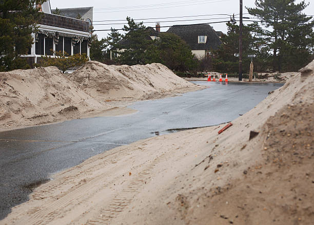 Street in Bay Head, NJ after Hurricane Sandy Piles of sand in a street due to Hurricane Sandy new jersey street flooding stock pictures, royalty-free photos & images
