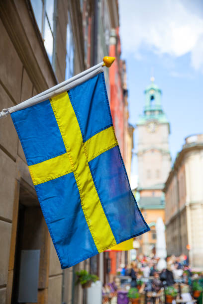 Street in Stockholm with swedish flag stock photo