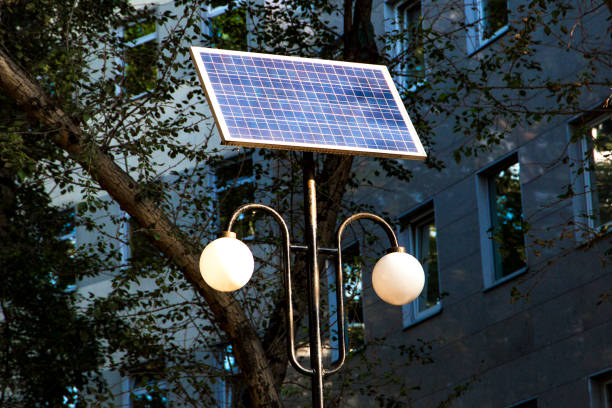 street lantern with solar panel battery stock photo