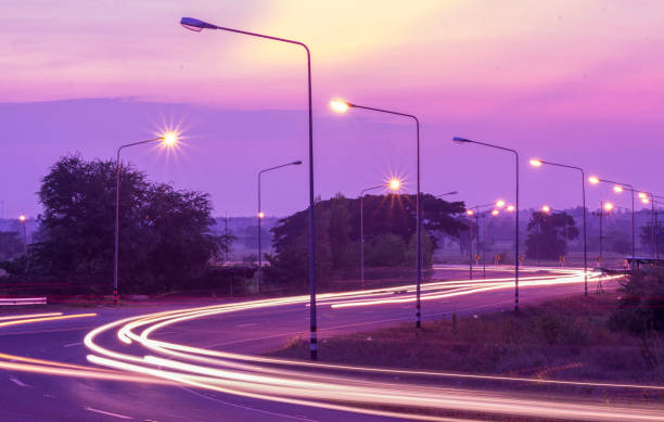 Street lighting at twilight Electricity that illuminates the streets at night in the Thai countryside street light stock pictures, royalty-free photos & images