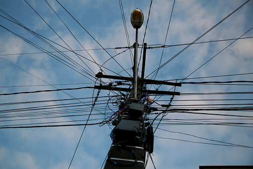 mata de sao joao, bahia / brazil - november 10, 2020: wiring is seen on a street lamp in the city of Mata de Sao Joao.
