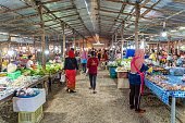 this image shows local street market in krabi town . Local thai people in market can be seen in image.