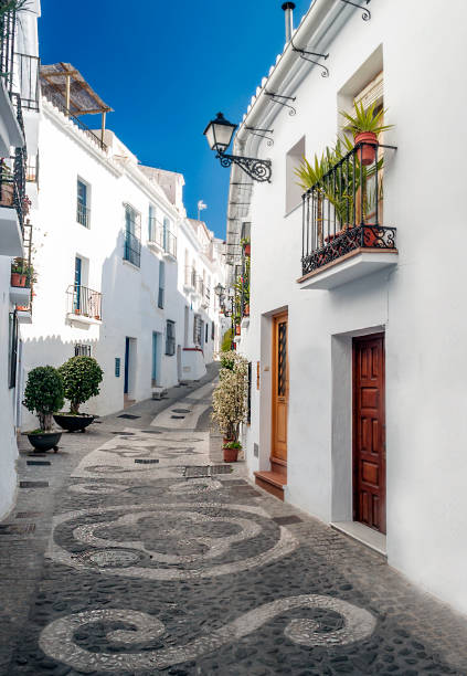 Street of Frigiliana town Street of white walls in a village of Andalusia called Frigiliana nerja stock pictures, royalty-free photos & images