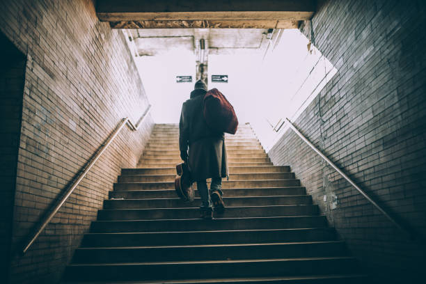 street performer walking up the steps - stairs subway imagens e fotografias de stock