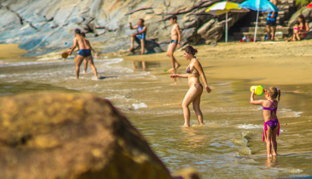 Street photograph documenting the daily life of beach life in Ilhabela, Brazil. stock photo
