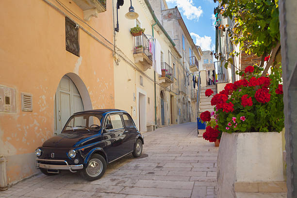 Street scene in an Italian village Vintage car in a small alley in Southern Italy lecce stock pictures, royalty-free photos & images