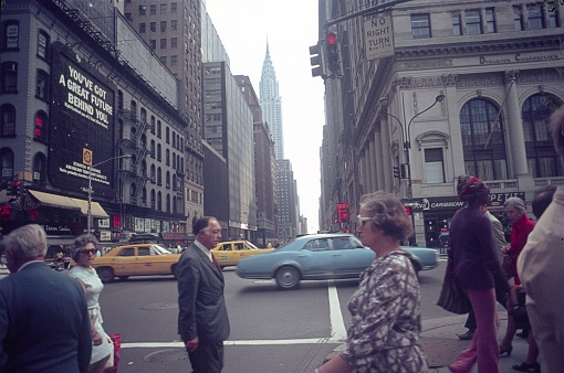 Manhattan, New York City, NY, USA, 1976. Street scene with pedestrians, buildings, cars and advertisements in Manhattan.