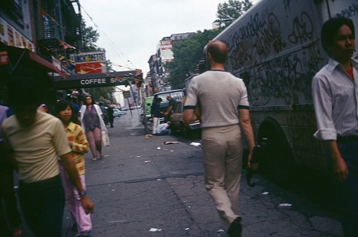 New York City, NY, USA, 1976. Street scene with passers-by and residents in New York City.