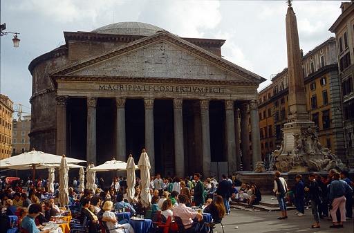 Rome, Lazio, Italy, 1988. Street scene with a crowded Cafe Terrasse and Panteon in the background at Piazza della Rotonda in Rome. Also: tourists and Romans.